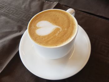 High angle view of cappuccino on table