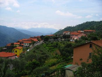 Buildings in town against sky