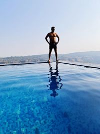 Full length of man standing in swimming pool