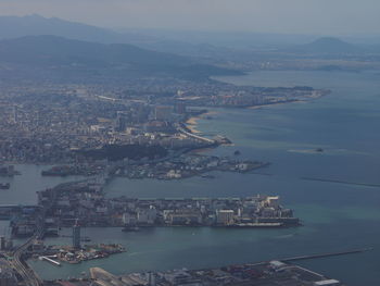 High angle view of city by sea