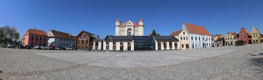 Low angle view of historic building against clear blue sky