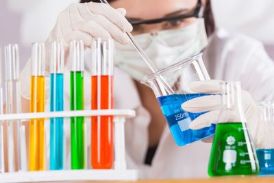 Female scientist holding medical sample at laboratory