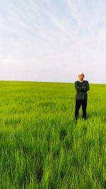 Full length of man standing in field