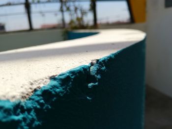 Close-up of blue cigarette on table