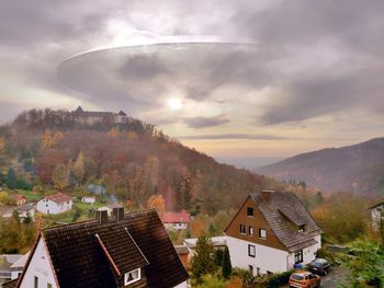 High angle view of houses and buildings against sky