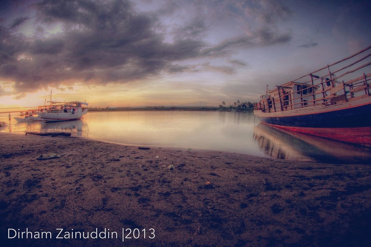 water, sky, sea, cloud - sky, beach, sunset, transportation, cloudy, nautical vessel, shore, scenics, beauty in nature, mode of transport, nature, dusk, sand, tranquility, tranquil scene, boat, cloud