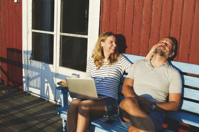 Young couple sitting outdoors