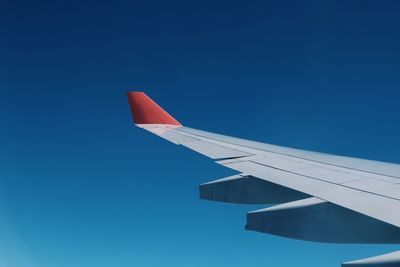 Low angle view of airplane flying in sky