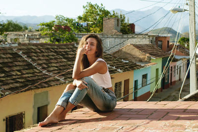 Beautiful woman siting on rooftop