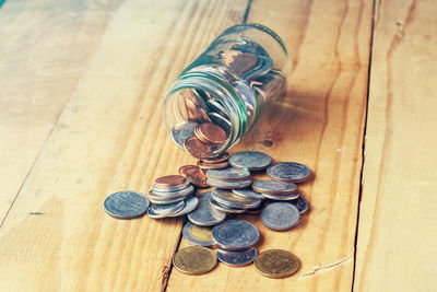 High angle view of coins on table