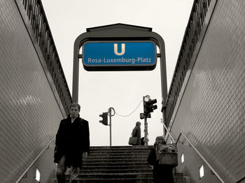 Low angle view of information sign against clear sky