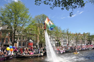 Group of people on boat against trees