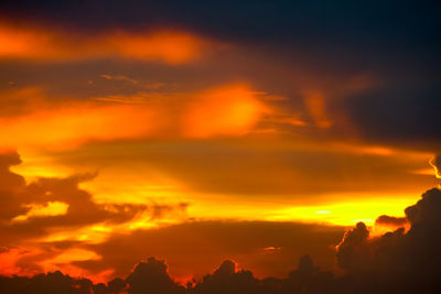 Low angle view of dramatic sky during sunset