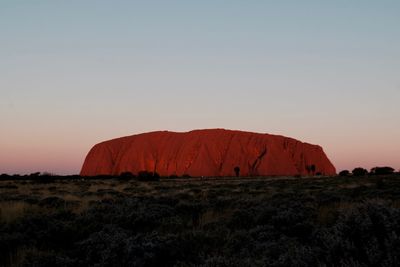 Scenic view of rock formation against sky during sunset