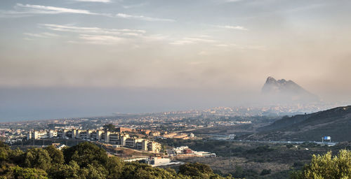 High angle view of buildings in city against sky