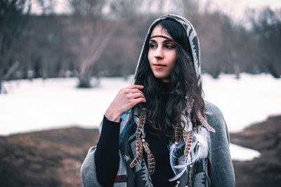 Portrait of beautiful young woman in winter