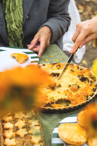 Midsection of man preparing food on table