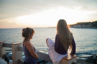 Woman looking at sunset
