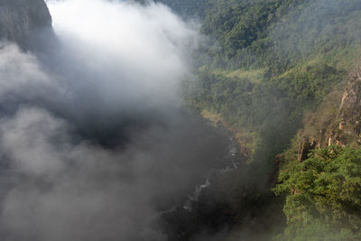 Scenic view of fog in mountain