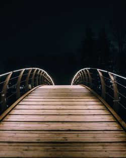 Illuminated bridge at night