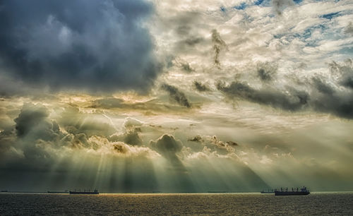 Scenic view of sea against cloudy sky