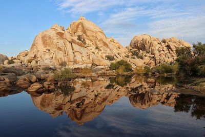 Scenic view of rock formations against sky