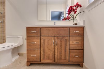 Wooden closed cabinet in bathroom