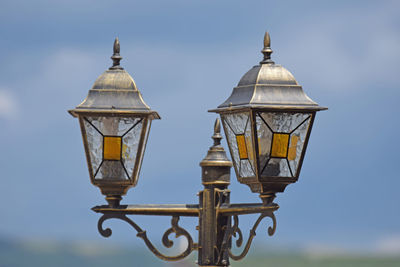 Low angle view of street light against sky