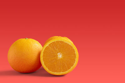 Close-up of oranges against orange background