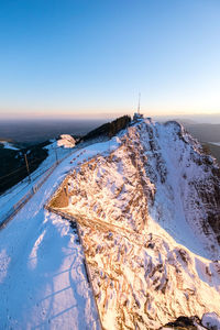 Scenic view of frozen sea against clear blue sky