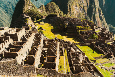 Machu picchu old inca ruins at sunrise in peru