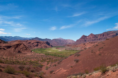 Scenic view of landscape and mountains against sky