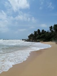 Scenic view of beach against sky