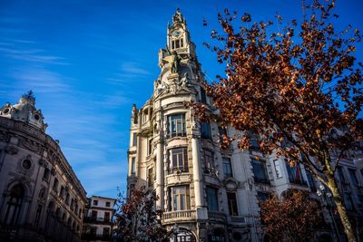 Low angle view of building against blue sky