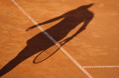 High angle view of shadow on sand