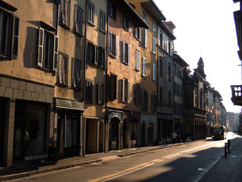 Vehicles on road along buildings