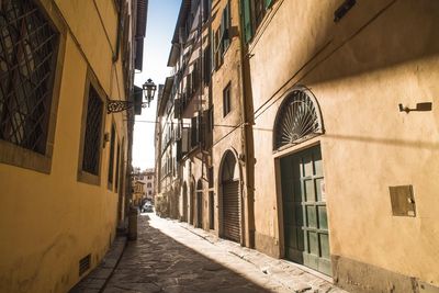 Narrow street amidst buildings in town