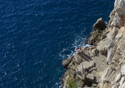 High angle view of rock formation in sea