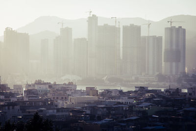 Modern buildings in city against sky