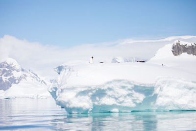 Scenic view of sea against sky during winter