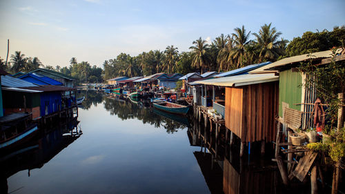 Boats moored in lake against sky