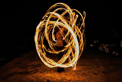 Illuminated fire on field at night