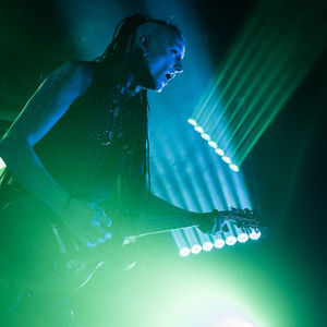 Young woman playing with umbrella