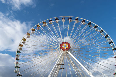 Low angle view of ferris wheel against sky