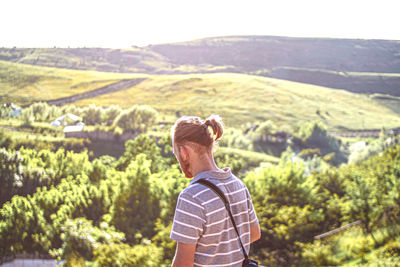 Rear view of woman looking at mountains