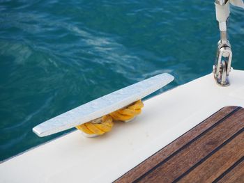 High angle view of a boat cleat on blue sea background 