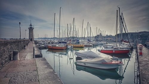 Boats moored at harbor