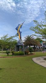 Built structure on field against sky