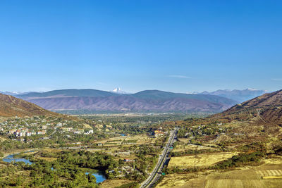 View of aragvi valley from jvari monastery hill, georgia. on the horizon is visible mount kazbek