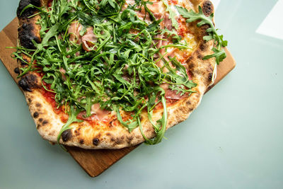 High angle view of pizza in plate on table